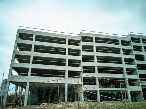 Multi-storey concrete structure under construction showing formed slabs and columns