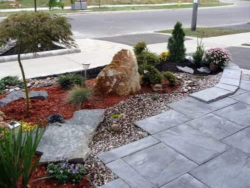 Finished decorative concrete sidewalk and landscaped front walkway in Charlotte, NC